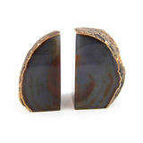 Agate bookends, front view showing raw exterior and polished interior bands.