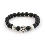 Lion charm bracelet with black onyx and white howlite beads.