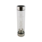 Cancer Laterra Gemstone Water Bottle with crystal quartz crystal attachment inside clear glass bottle on white background.