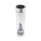 Scorpio Laterra Gemstone Water Bottle with astrophyllite crystal attachment inside clear glass bottle on white background.